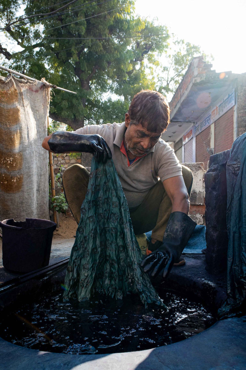 Man dyeing fabric